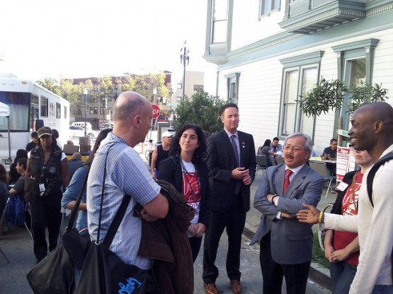 San Francisco Mayor Ed Lee (D) speaks with attendees at Project Homeless Connect on October 17, 2013.