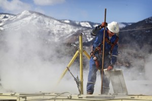 A worker checks on a hydraulic fracturing, or ‘fracking,’ operation in Colorado. CREDIT: AP Photo/Brennan Linsley