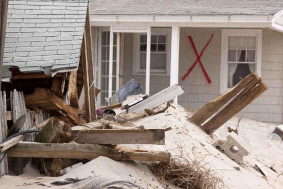 A red X spray painted on a destroyed home on January 13, 2013 in Chadwick, New Jersey. Clean up continues 75 days after Hurricane Sandy struck the shore in October 2012. CREDIT: Glynnis Jones