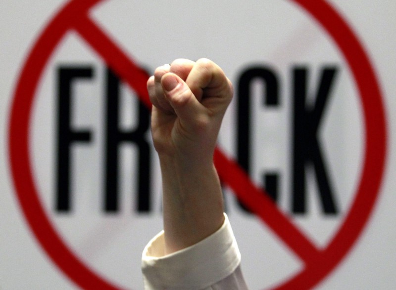 Gillie Waddington of Enfield, N.Y., raises a fist during rally against hydraulic fracturing of natural gas wells at the Legislative Office Building in Albany, N.Y., on Monday, Jan. 23, 2012. CREDIT: AP PHOTO/MIKE GROLL