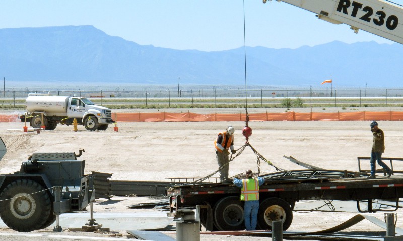 A construction crew works on a $10.4 million fueling facility on Monday, May 24, 2010, at Kirtland Air Force Base, N.M. The project replaces a 1950s-era bulk fuel facility where leaking pipes created an underground fuel plume. CREDIT: AP PHOTO/TIM KORTE