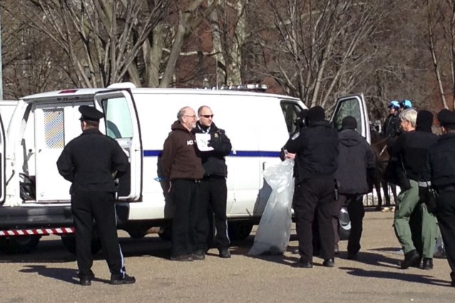 Patrick Carolan, Executive Director of the Franciscan Action Network, poses for a mug shot after getting arrested. Carolan fasted for 13 days last year to bring attention to the need for immigration reform. CREDIT: ThinkProgress/ Esther Y. Lee