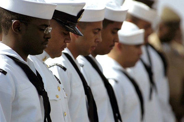 Immigrant sailors being naturalized aboard the USS Ronald Reagan. CREDIT: Wikimedia Commons