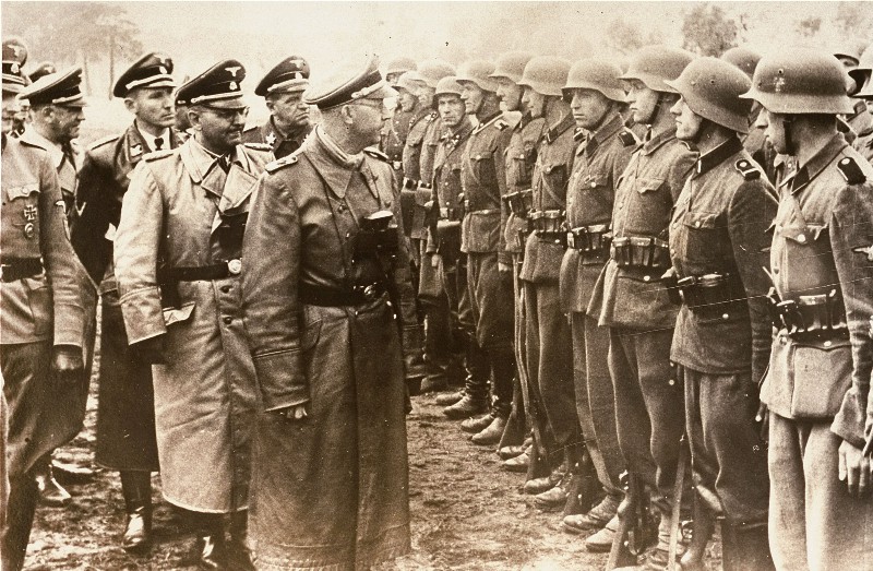 Gestapo chief Heinrich Himmler reviews Nazi troops in 1944. CREDIT: AP