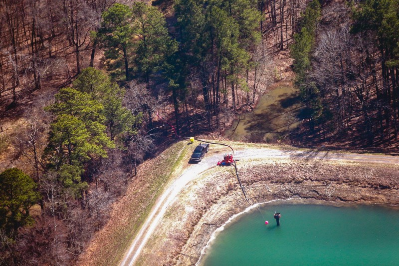 Photographs show Duke personnel using a portable water pump to empty its 1978 coal ash pond. The plant’s Clean Water Act permit only authorizes discharges when the pond level overtops the vertical discharge pipe visible in the photo, in order to reduce discharges of toxic solids in the effluent. CREDIT: WATERKEEPER.ORG