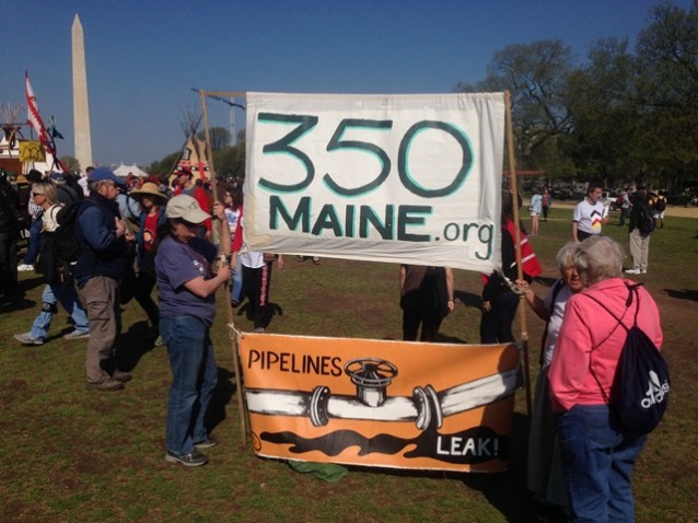 Protestors from 350 Maine show support for the rally. CREDIT: ThinkProgress/MasonAtkins