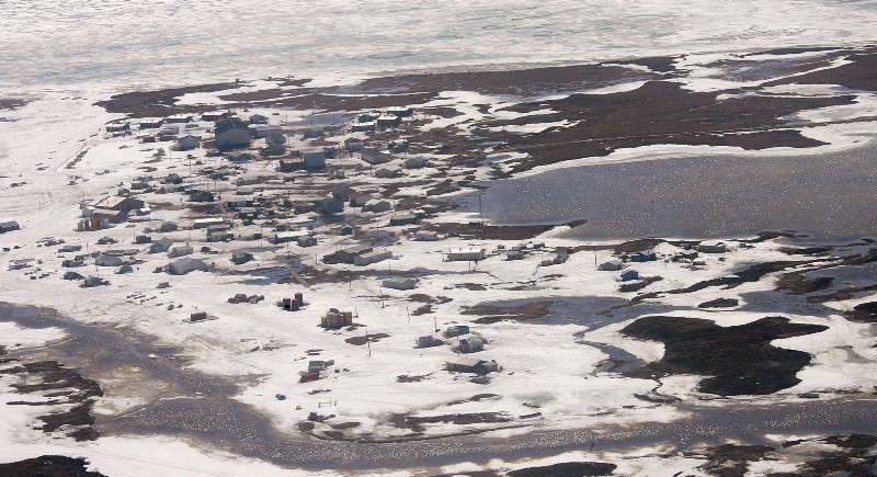This picture shows Newtok, Alaska, where the eroding bank along the Ninglick River has long been a problem for the village 480 miles west of Anchorage. As erosion creeps ever closer, residents of a tiny southwest Alaska village continue their slow but steady work to relocate to higher ground. CREDIT: AP PHOTO/AL GRILLO