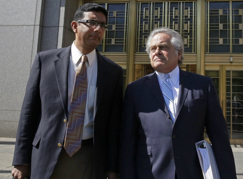 Danesh D’Souza (left) and his attorney leave the court after his Tueday guilty plea CREDIT: AP PHOTO/RICHARD DREW