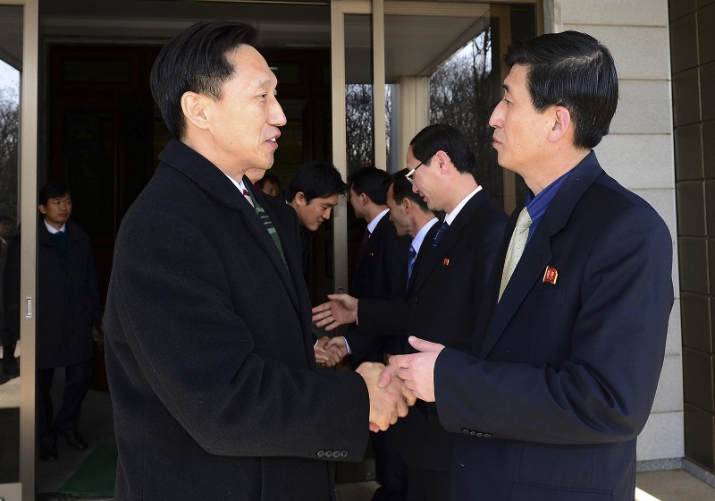 North Korea’s delegation chief, right, shakes hands with his counterpart during a meeting between North and South Korea CREDIT: AP PHOTO/SOUTH KOREAN UNIFICATION MINISTRY