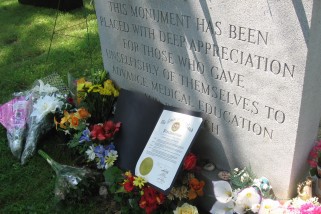 Flowers adorn a grave for those whose bodies were used by the Maryland State Anatomical Board. CREDIT: Christie Thompson