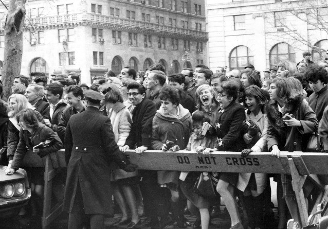 Feb. 7, 1964: fans pushing forward in hopes of getting a view of The Beatles after their arrival for an American tour in New York. (AP Photo, File) CREDIT: Associated Press