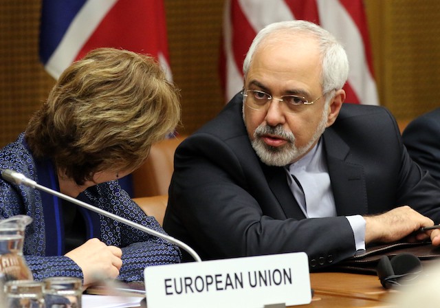 European foreign policy chief Catherine Ashton, left, and Iranian Foreign Minister Mohamad Javad Zarif, right, wait for the start of closed-door nuclear talks in Vienna, Austria, Tuesday, June 17, 2014. (AP Photo/Ronald Zak) CREDIT: AP