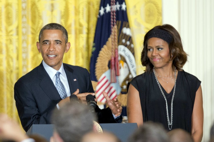 The Obamas speak with guests at the White House Pride Month reception Monday evening. CREDIT: AP PHOTO/MANUEL BALCE CENETA