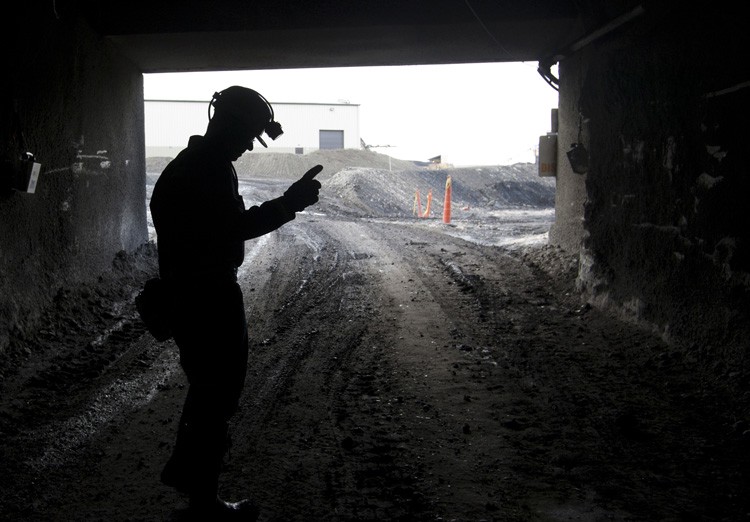 A mine employee stands in the entry of the Signal Peak Energy mine in Roundup, Montana on November 9, 2010. CREDIT: AP/JANIE OSBORNE