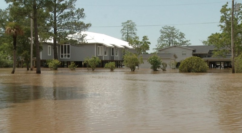 In Foley, Alabama, some people couldn’t get out of their homes on Wednesday, April 30, 2014, after flood waters surrounded their homes, many of which are built on stilts. CREDIT: AP PHOTO/ALEX SANZ