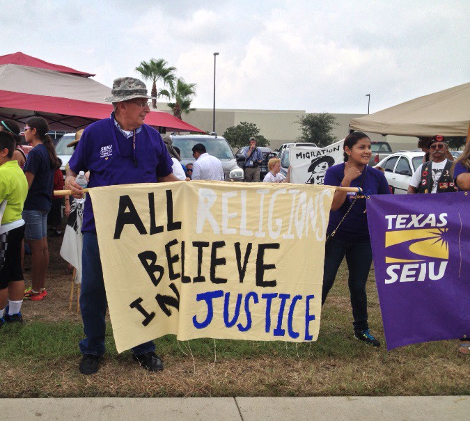 Activists carried signs supporting immigration reform in McAllen, Texas in July 2014. CREDIT: ESTHER Y. LEE