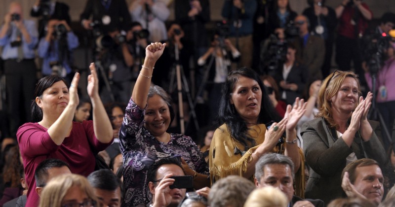 Supporters cheer as President Barack Obama signs a reauthorization of the Violence Against Women Act in 2013 CREDIT: AP PHOTO/SUSAN WALSH