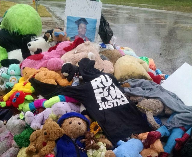A Run for Justice t-shirt was placed on Mike Brown’s memorial CREDIT: Erica Hellerstein