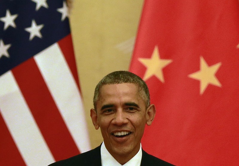 U.S. President Barack Obama smiles while he speaks during a joint press conference with Chinese President Xi Jinping at the Great Hall of the People in Beijing, China Wednesday, Nov. 12, 2014. CREDIT: AP PHOTO/ANDY WONG