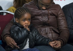 Akaila Gurley, 2, daughter of Akai Gurley, is held by her mother. CREDIT: AP Photo/Craig Ruttle