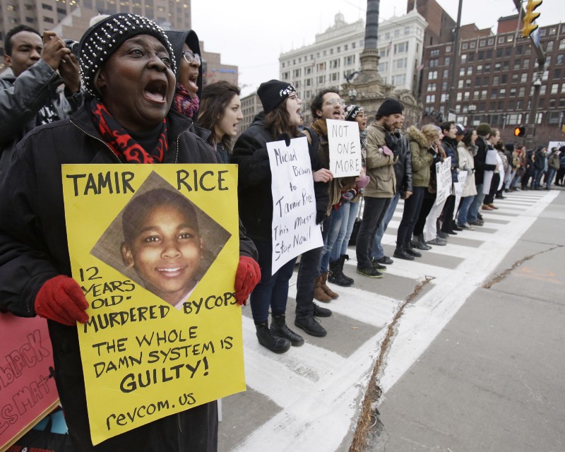 Demonstrators block Public Square in Cleveland, during a protest. CREDIT: AP PHOTO/TONY DEJAK