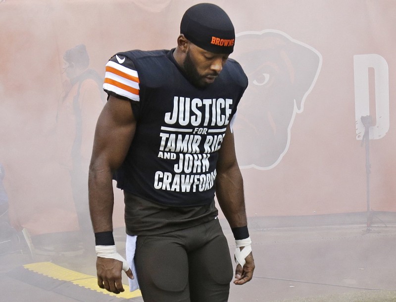 Cleveland Browns wide receiver Andrew Hawkins wears a shirt calling attention to the police shooting of Tamir Rice before an NFL football game against the Cincinnati Bengals Sunday, Dec. 14, 2014, in Cleveland. CREDIT: AP PHOTO