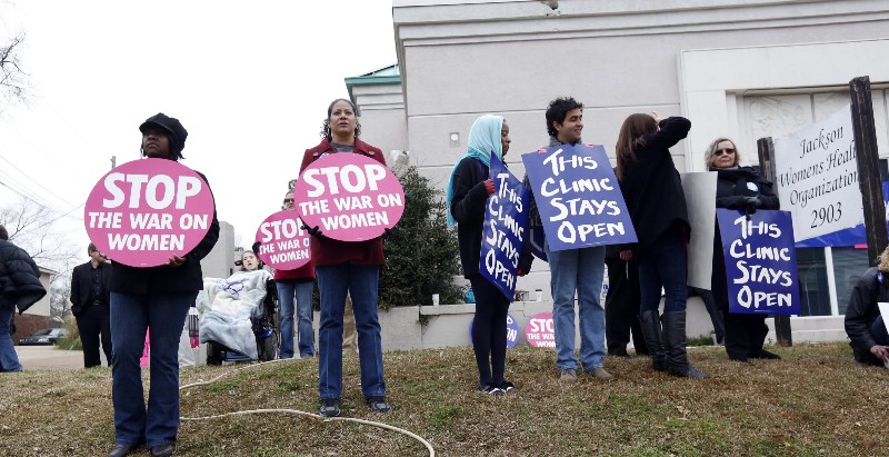 Abortion rights supporters stand outside the Jackson Women’s Health Organization Inc., the only abortion clinic in Mississippi CREDIT: AP PHOTO/ROGELIO V. SOLIS