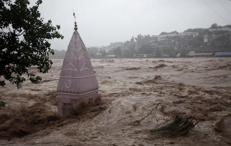A temple is partially submerged in floodwaters in Jammu, India, Saturday, Sept. 6, 2014. CREDIT: AP PHOTO/CHANNI ANAND