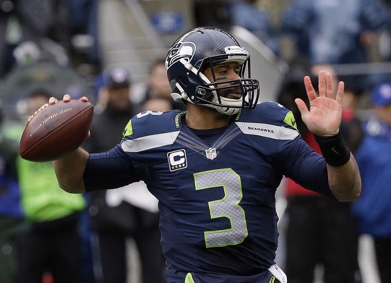 Russell Wilson during the first half of Sunday’s NFC Championship game. CREDIT: (AP PHOTO/DAVID J. PHILLIP)