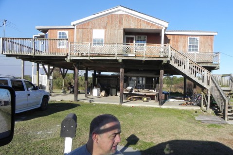 The few remaining residents in Louisiana’s frequently flooded coastal wetlands live in elevated homes. CREDIT: Alice Ollstein