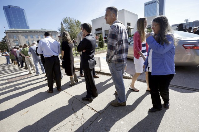 Voters wait in line to vote early at Little Rock, Ark., polling place Monday, Nov. 3, 2014, in advance of the Tuesday election. CREDIT: AP Photo/Danny Johnston