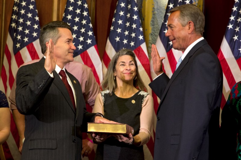 Rep. Jody Hice (R-GA) getting sworn in by House Speaker John Boehner (R-OH) CREDIT: JACQUELYN MARTIN/AP