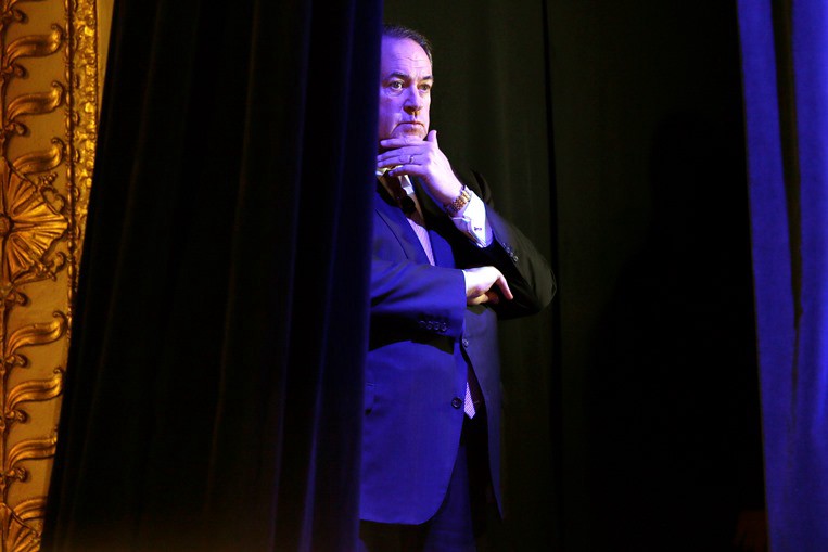 Gov. Mike Huckabee (R) backstage at the 2015 Iowa Freedom Summit. CREDIT: AP PHOTO/CHARLIE NEIBERGALL