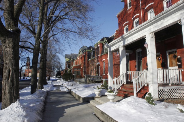 In this Feb. 13, 2008 file photo, the landmark Pullman Works administration building and its 12-story clock tower is seen at left from the row houses in the Pullman District neighborhood in Chicago. The director of the National Park Service toured the historic neighborhood Thursday, June 14, 2012, to learn more about the site being considered for national park status. The neighborhood was founded by industrialist George Pullman in 1880. It was known for manufacturing Pullman Palace Sleeper Cars, the most luxurious railcar for nearly a century. CREDIT: (AP Photo/Seth Perlman, File