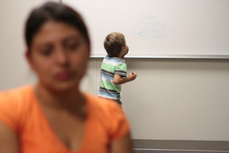 An unidentified immigrant from Guatemala and her son at the Artesia Family Residential Center, a federal detention facility for undocumented immigrant mothers and children in Artesia, NM. CREDIT: JUAN CARLOS LLORCA/AP