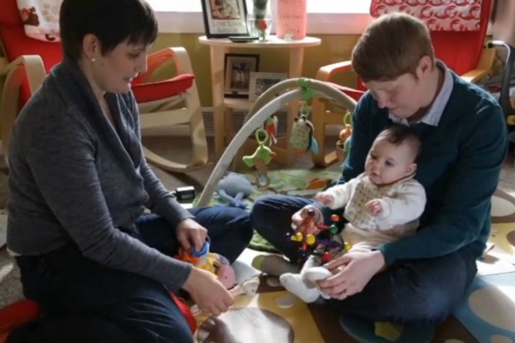 Krista and Jami Contreras with their daughter, Bay Windsor. CREDIT: DETROIT FREE PRESS