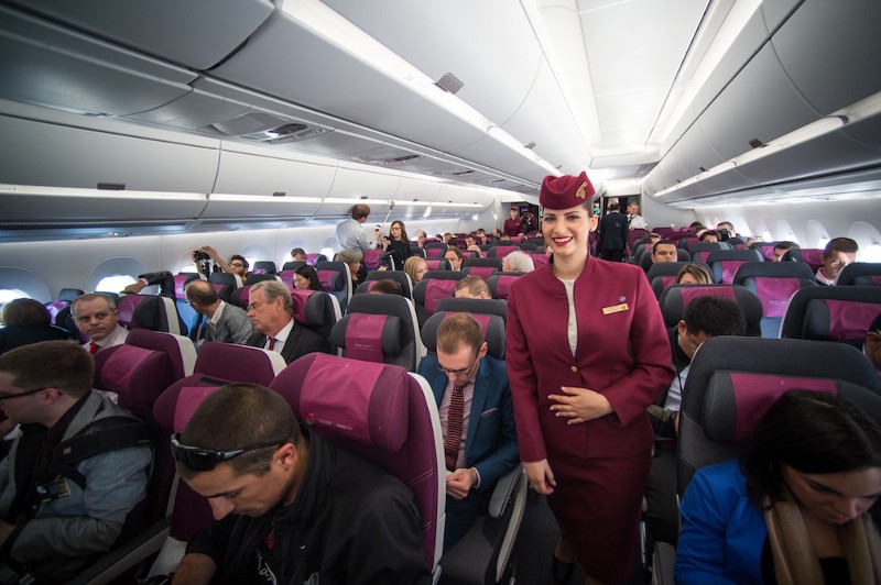 A Qatar Airways flight attendant CREDIT: AP/FRED LANCELOT
