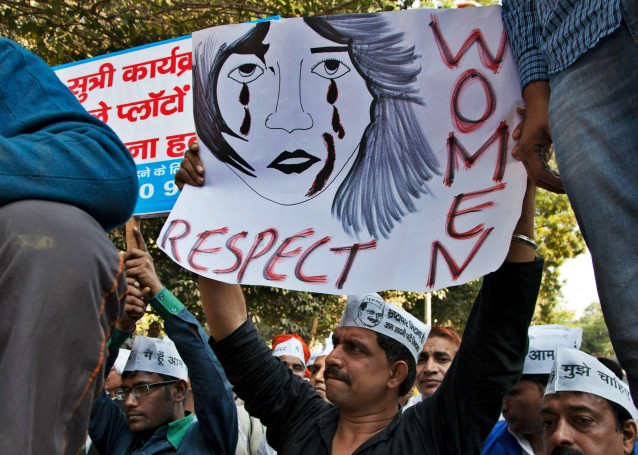 Supporters of Aam Aadmi (Common Man) Party (AAP) hold placards during a protest on Dec. 8, 2014, after a woman was allegedly raped by a driver from ride-booking service Uber in New Delhi, India. CREDIT: Tsering Topgyal/AP