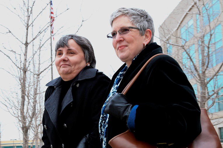 Susan and Sally Waters, two of the plaintiffs in the Nebraska marriage case. Sally has been diagnosed with Stage IV metastatic breast cancer, which has spread to her spine. Susan carries health insurance for the whole family through her employer, and neither has survivor benefits. CREDIT: AP PHOTO/NATI HARNIK