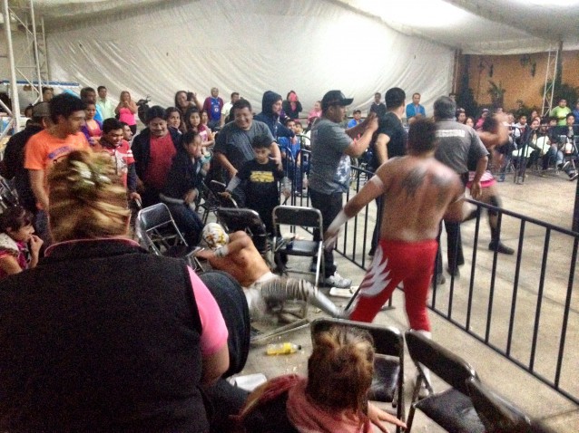 Luchadores take the fight into the audience. In quintessential Mexican fashion, zero precautions were taken as wrestlers were hurled onto unexpecting audiencemembers. CREDIT: Scott Keyes