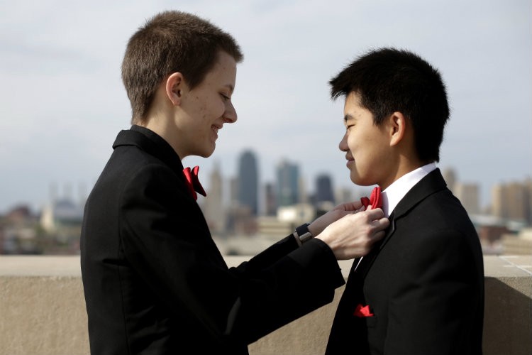 Transgender high school students Isaac and Jasen prepare to attend their prom in Kansas City, Missouri. CREDIT: AP PHOTO/CHARLIE RIEDEL
