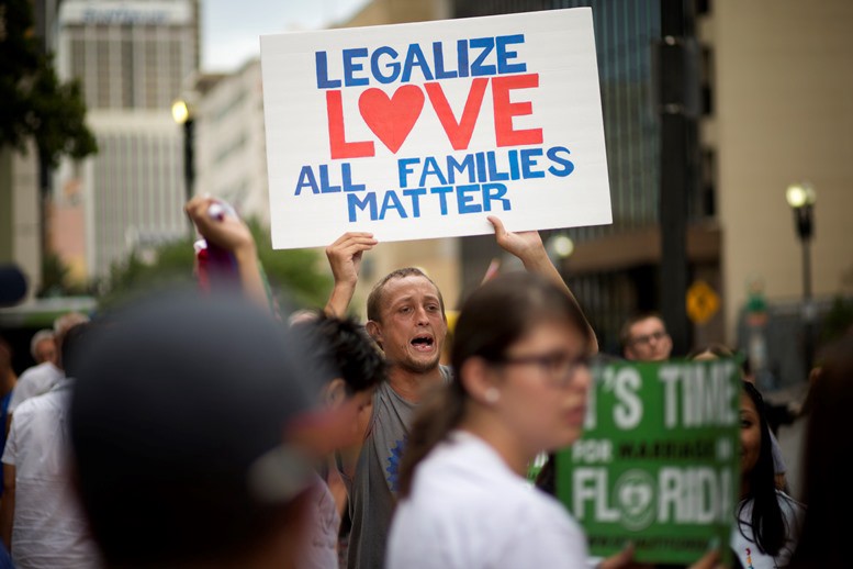 A scene from a marriage equality rally in Miami this past July. CREDIT: AP PHOTO/J PAT CARTER