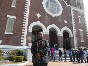 Selma auto worker Latasha Irby outside the historic Brown Chapel AME. CREDIT: Alice Ollstein
