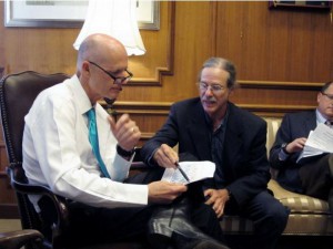 Florida State University environmental science professor Jeffrey Chanton gives a presentation to Florida Gov. Rick Scott on climate change on Tuesday, Aug. 19, 2014 in Tallahassee, Fla. CREDIT: AP PHOTOS/BRENDAN FARRINGTON
