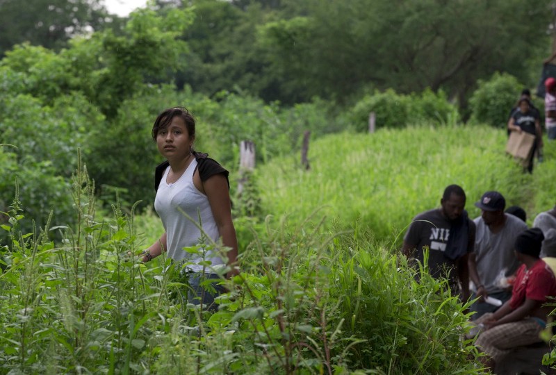 A 14-year-old Guatemalan migrant is left stranded in a wooded area in Mexico after the freight train she was traveling on had a minor derailment. CREDIT: REBECCA BLACKWELL/ AP