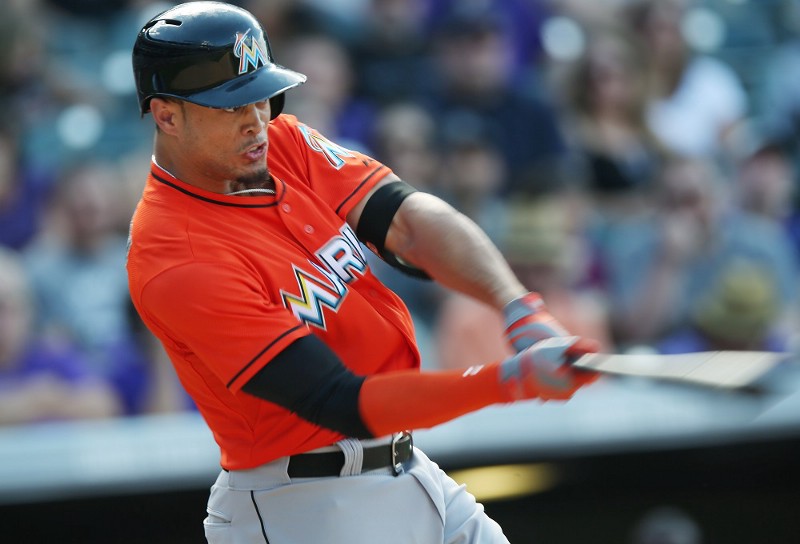 Even with big contracts like Giancarlo Stanton’s, baseball salaries aren’t keeping up with revenue growth. CREDIT: (AP PHOTO/DAVID ZALUBOWSKI)