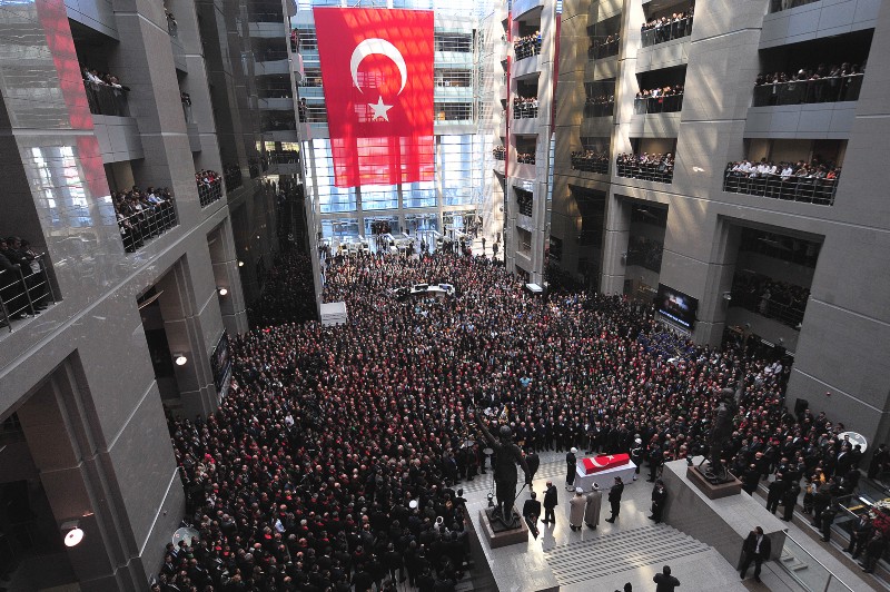 Thousands gather at the funeral of the Turkish prosecutor who was taken hostage in March. Images of him being held at gunpoint circulated on Twitter and the government banned the site. CREDIT: AP PHOTO