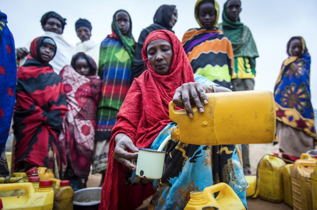 Dima Halke sells milk to provide for her eight children. Through a Mercy Corps program, Dina now runs a small business buying milk from neighbors and selling it for profit at a milk collection site. CREDIT: Sean Sheridan for Mercy Corps