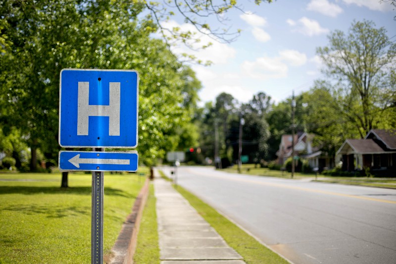 A sign points the way to Flint River Hospital, which closed its emergency room last year, in Montezuma, Ga. CREDIT: AP PHOTO/DAVID GOLDMAN