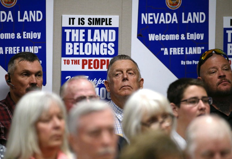 Nevada rancher Cliven Bundy, center, listens to testimony on a bill challenging federal control of Nevada public lands in a hearing at the Legislative Building in Carson City, Nev., Tuesday, March 31, 2015. CREDIT: AP PHOTO/CATHLEEN ALLISON